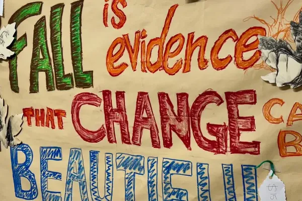 A colorful poster that says, 'Fall is evidence that change can be beautiful.'