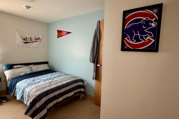 A bedroom is pictured decorated with Chicago sports memorabilia