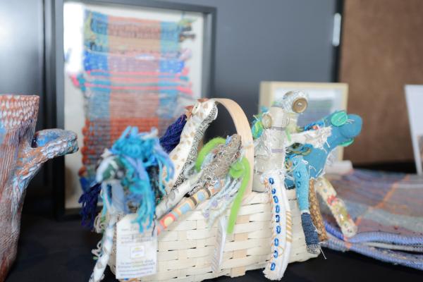 A display of handmade, colorful woven art