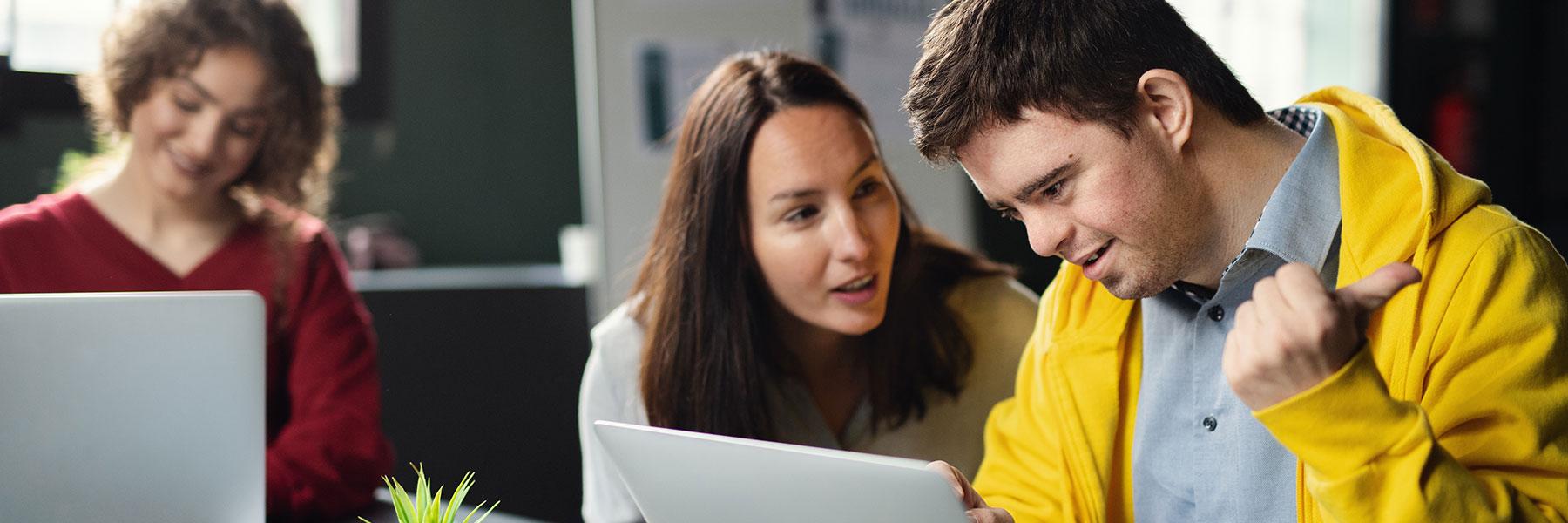 Man with Down syndrome attending education class in community center