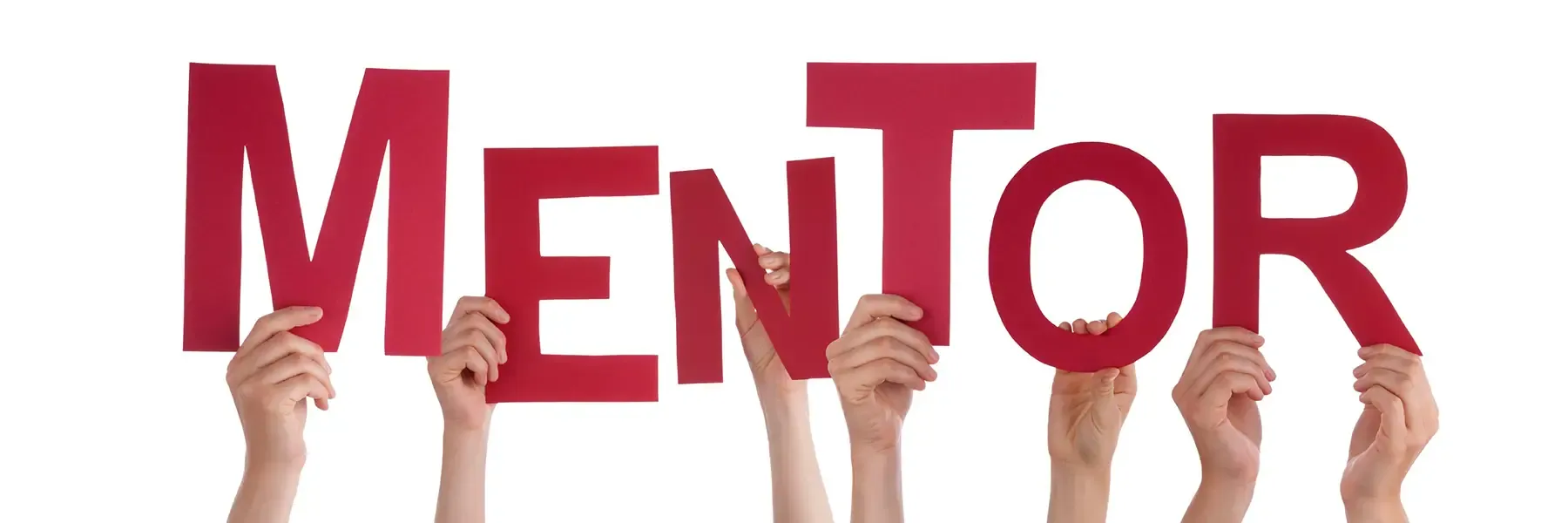 Hands holding up red letters spelling 'MENTOR'.