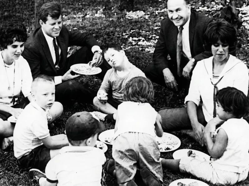 Sen. Ted Kennedy eats hot dogs with developmentally disabled children at day camp at 55th Street on Lake Michigan in Chicago on July 16, 1963.